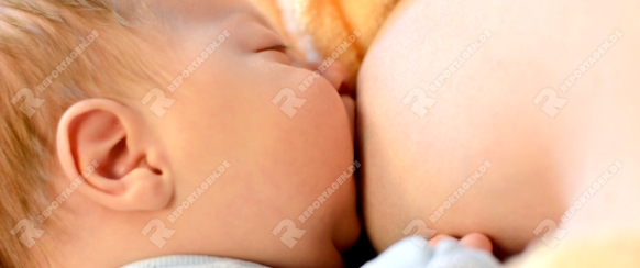 Mother breastfeeding her baby. Healthy lifestyle concept.